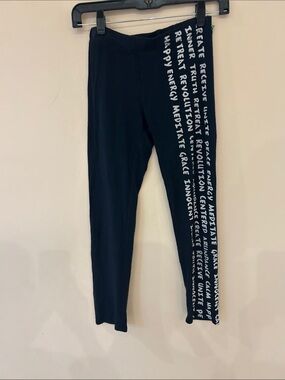 Leggings with inspirational printing on legs.